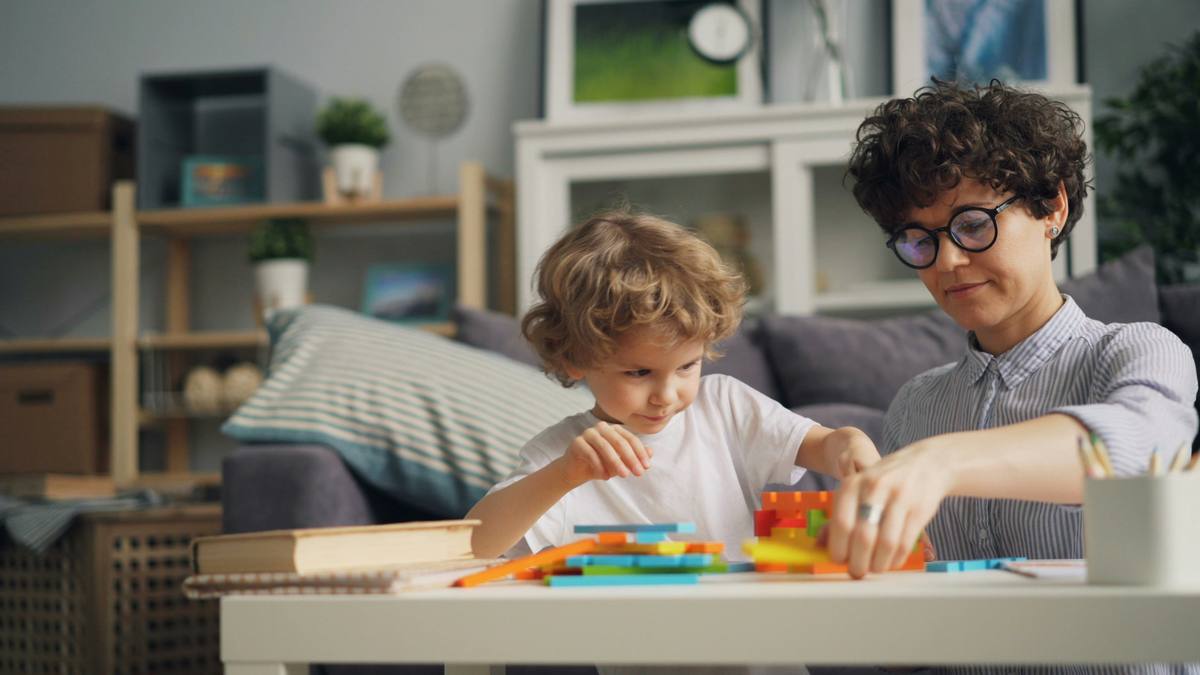Child working with ABA therapist